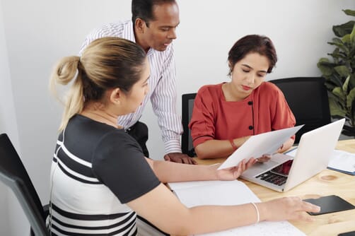 group-serious-business-executives-gathered-office-table-discuss-reports-with-sales-data-min (1) group-serious-business-executives-gathered-office-table-discuss-reports-with-sales-data-min (1)